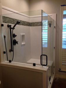 shower with glass walls and moveable head